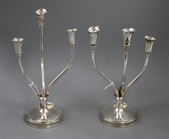 A pair of Peruvian Camusso sterling silver three stem candelabra, 28.3cm.